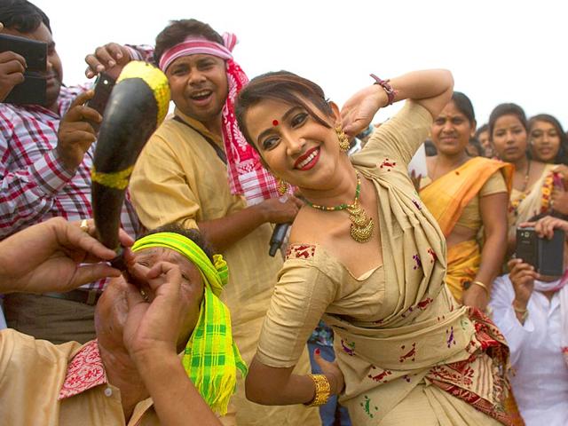 Assamese people perform Bihu dance during Rongali Bihu, a harvest festival, in Guwahati. (AP Photo)