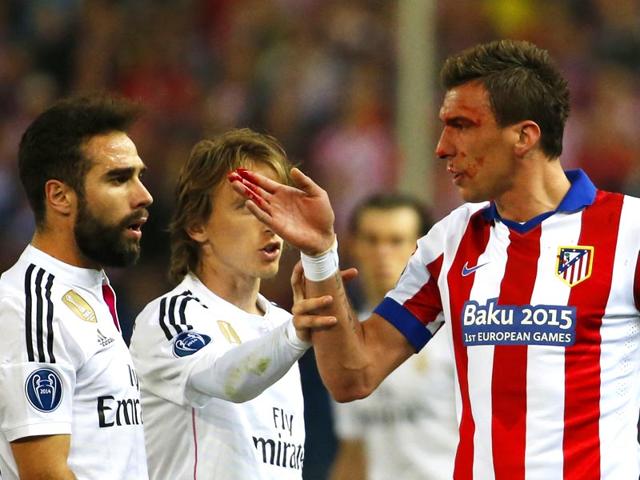 Atletico-s-Mario-Mandzukic-was-left-with-a-bloody-nose-thanks-to-a-stray-elbow-from-Sergio-Ramos-and-the-Croatian-was-on-the-end-of-more-rough-treatment-soon-after-when-Carvajal-punched-him-in-the-stomach-Reuters-Photo Atletico-s-Mario-Mandzukic-was-left-with-a-bloody-nose-thanks-to-a-stray-elbow-from-Sergio-Ramos-and-the-Croatian-was-on-the-end-of-more-rough-treatment-soon-after-when-Carvajal-punched-him-in-the-stomach-Reuters-Photo