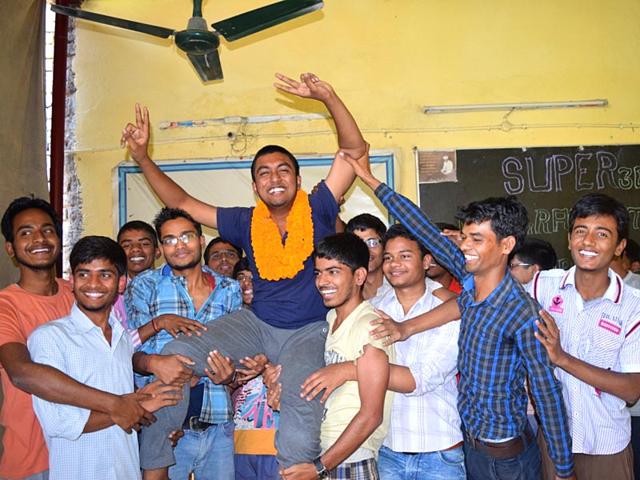 Super-30-founder-Anand-Kumar-offering-sweets-to-Abhishek-Gupta-who-was-selected-to-pursue-international-programme-from-the-University-of-Tokyo-AP-Dube-HT-Photo Super-30-founder-Anand-Kumar-offering-sweets-to-Abhishek-Gupta-who-was-selected-to-pursue-international-programme-from-the-University-of-Tokyo-AP-Dube-HT-Photo
