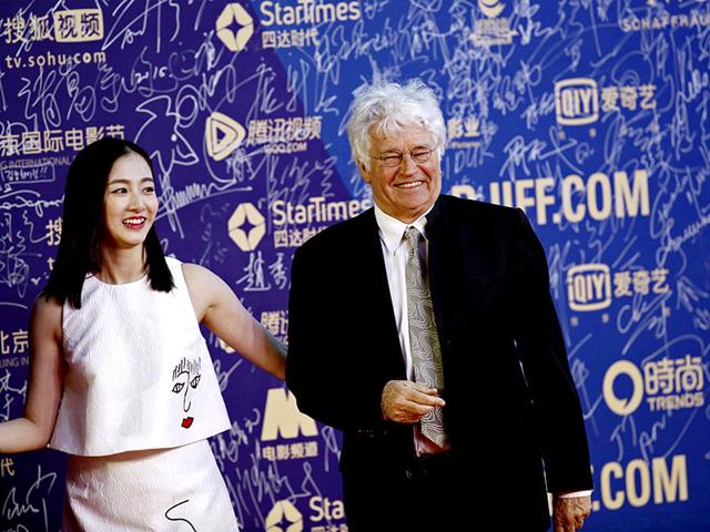 French director Jean-Jacques Annaud (R) walks the red carpet ceremony of the Beijing International Film Festival, in Beijing, April 16, 2015. (Reuters) French director Jean-Jacques Annaud (R) walks the red carpet ceremony of the Beijing International Film Festival, in Beijing, April 16, 2015. (Reuters)