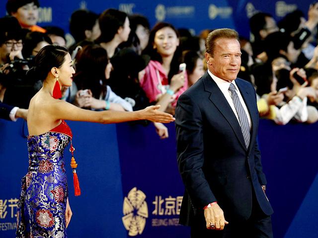 US actor Arnold Schwarzenegger walks on the red carpet at the Beijing International Film Festival April 16, 2015. (Reuters)