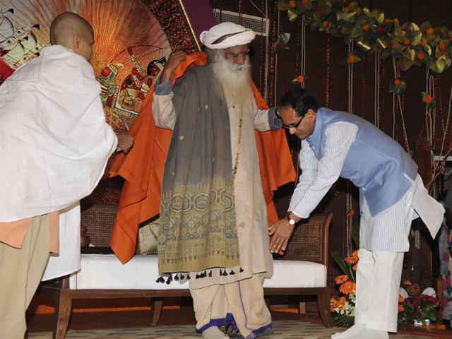 CM-Shivraj-Singh-Chouhan-seeks-blessings-of-Yogi-Sadguru-Jaggi-Vasudev-Maharaj-during-a-seminar-in-Bhopal-on-Friday-Vasudev-said-material-prosperity-is-meaningless-without-spiritual-awakening-and-Simhastha-Mahakumbh-2016-will-pave-way-for-the-same-Praveen-Bajpai-HT-photo CM-Shivraj-Singh-Chouhan-seeks-blessings-of-Yogi-Sadguru-Jaggi-Vasudev-Maharaj-during-a-seminar-in-Bhopal-on-Friday-Vasudev-said-material-prosperity-is-meaningless-without-spiritual-awakening-and-Simhastha-Mahakumbh-2016-will-pave-way-for-the-same-Praveen-Bajpai-HT-photo
