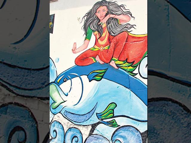 Delhi street art: Painted by a bunch of local artists, these walls speak of a common theme: women's empowerment. Each of the three walls in Connaught Place depicts a woman in a commanding and confident posture interacting with three basic elements - earth, wind and water. Delhi street art: Painted by a bunch of local artists, these walls speak of a common theme: women's empowerment. Each of the three walls in Connaught Place depicts a woman in a commanding and confident posture interacting with three basic elements - earth, wind and water.