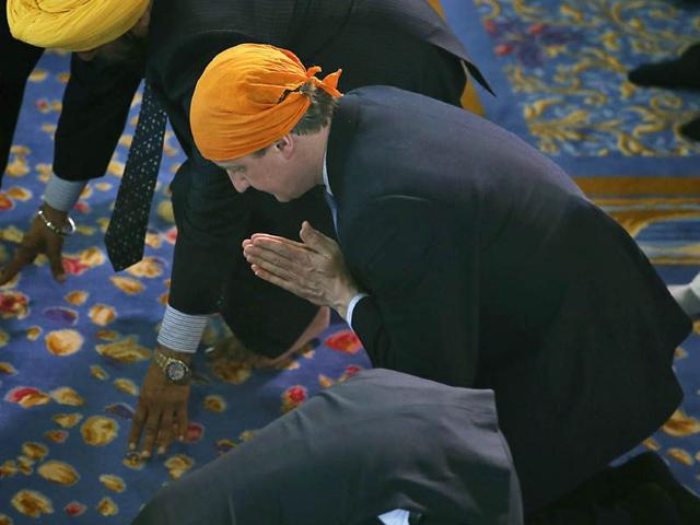 The-Prime-Minister-and-his-wife-joined-some-3-000-worshippers-for-the-spring-Festival-of-Vaisakhi-as-Cameron-continues-campaigning-ahead-of-the-upcoming-May-7-General-Election-AP The-Prime-Minister-and-his-wife-joined-some-3-000-worshippers-for-the-spring-Festival-of-Vaisakhi-as-Cameron-continues-campaigning-ahead-of-the-upcoming-May-7-General-Election-AP