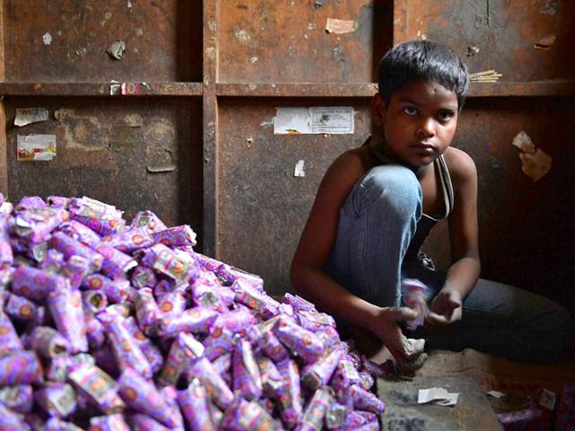 A-young-Indian-labourer-packs-bidis-into-colourful-conical-packets-and-boxes-at-The-New-Sarkar-Bidi-Factory-in-Kannauj-AFP-Photo