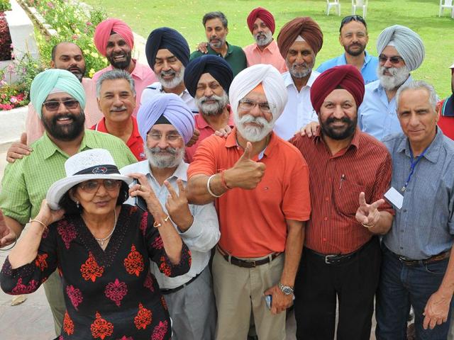 Newly-elected-president-Birinder-Singh-Gill-orange-t-shirt-along-with-other-members-at-Chandigarh-Golf-Club-Keshav-Singh-HT