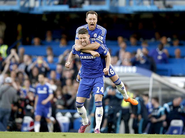 Chelsea-s-English-defender-John-Terry-and-Chelsea-s-English-defender-Gary-Cahill-celebrate-their-1-0-victory-after-the-final-whistle-of-the-English-Premier-League-football-match-between-Chelsea-and-Manchester-United-at-Stamford-Bridge-in-London-AFP-PHOTO