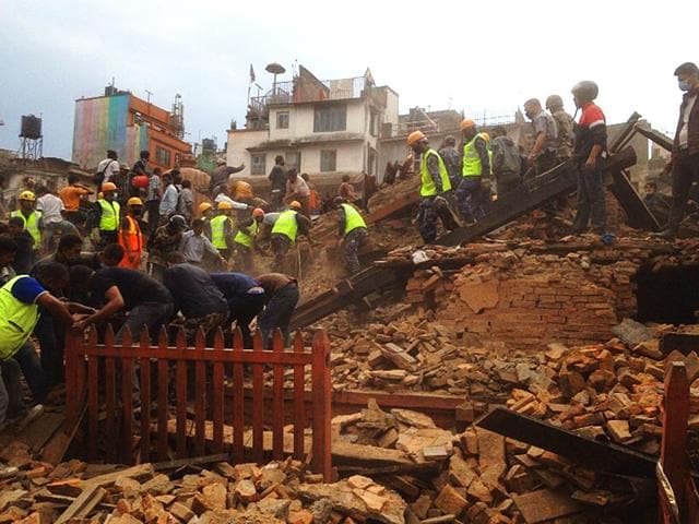 In-this-photo-released-by-China-s-Xinhua-News-Agency-a-collapsed-building-is-seen-in-Nepal-s-capital-Kathmandu-AP-Photo