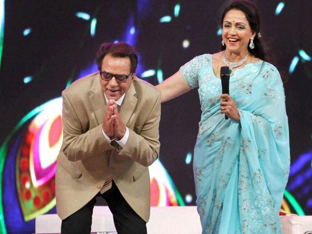 Hema-Malini-along-with-her-husband--and-actor-Dharmendra-greeting-people-during-Sri-Krishna-Mahostav-in-Mathura-PTI-photo Hema-Malini-along-with-her-husband--and-actor-Dharmendra-greeting-people-during-Sri-Krishna-Mahostav-in-Mathura-PTI-photo