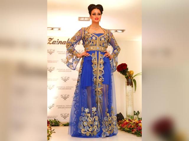 This cobalt blue gown with golden detailing by Zainab Al-Kiswani is the perfect example of Eastern-detailing-meets-Western-sensibilities. Agree? This cobalt blue gown with golden detailing by Zainab Al-Kiswani is the perfect example of Eastern-detailing-meets-Western-sensibilities. Agree?