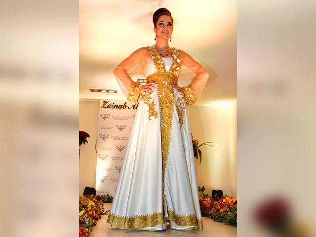 Show off your soft and feminine side in this stunning ivory-and-gold gown from the runways in Amman. Show off your soft and feminine side in this stunning ivory-and-gold gown from the runways in Amman.
