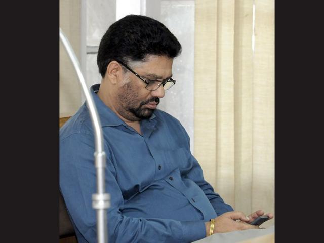 Nominated member Surinder Bagha seems to be more interested in what's there in his phone. Gurpreet Singh/HT