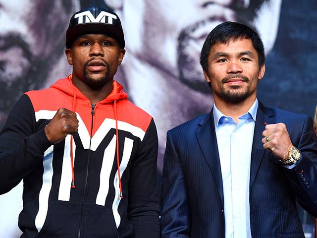 WBC-WBA-welterweight-champion-Floyd-Mayweather-Jr-and-WBO-welterweight-champion-Manny-Pacquiao-pose-during-a-news-conference-at-the-KA-Theatre-at-MGM-Grand-Hotel-amp-Casino-in-Las-Vegas-Nevada-AFP-PHOTO WBC-WBA-welterweight-champion-Floyd-Mayweather-Jr-and-WBO-welterweight-champion-Manny-Pacquiao-pose-during-a-news-conference-at-the-KA-Theatre-at-MGM-Grand-Hotel-amp-Casino-in-Las-Vegas-Nevada-AFP-PHOTO