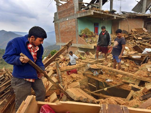 People-clear-the-debris-of-an-earthquake-damaged-house-in-Sindhupalchok-district-Nepal-Gurinder-Osan-HT-Photo People-clear-the-debris-of-an-earthquake-damaged-house-in-Sindhupalchok-district-Nepal-Gurinder-Osan-HT-Photo