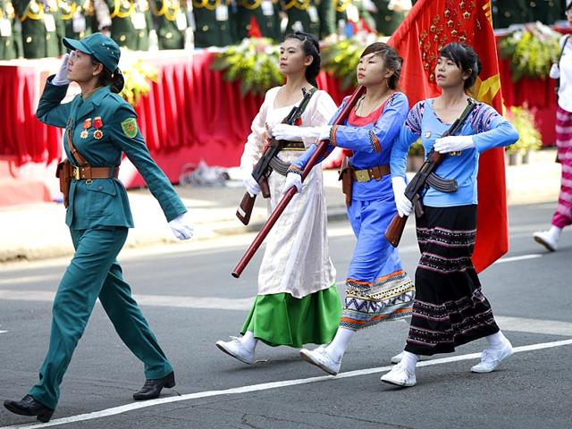 Vietnamese military personnel in traditional dress take part in the parade in Ho Chi Mihn City. (AP Photo)