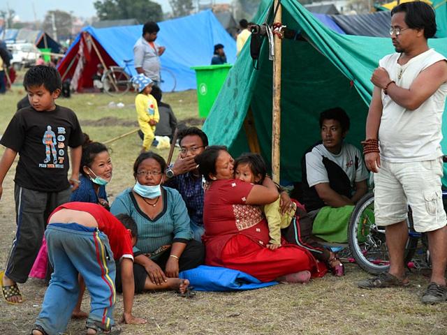 People-rest-at-a-makeshift-tent-at-Tudikhel-ground-in-Kathmandu-Nepal-Gurinder-Osan-HT-Photo People-rest-at-a-makeshift-tent-at-Tudikhel-ground-in-Kathmandu-Nepal-Gurinder-Osan-HT-Photo
