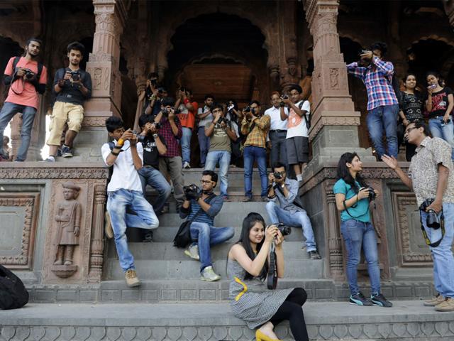 Students participate in heritage photo walk at Krishnapura Chhatri, Rajwada, in Indore on Saturday. (Arun Mondhe/HT photo)