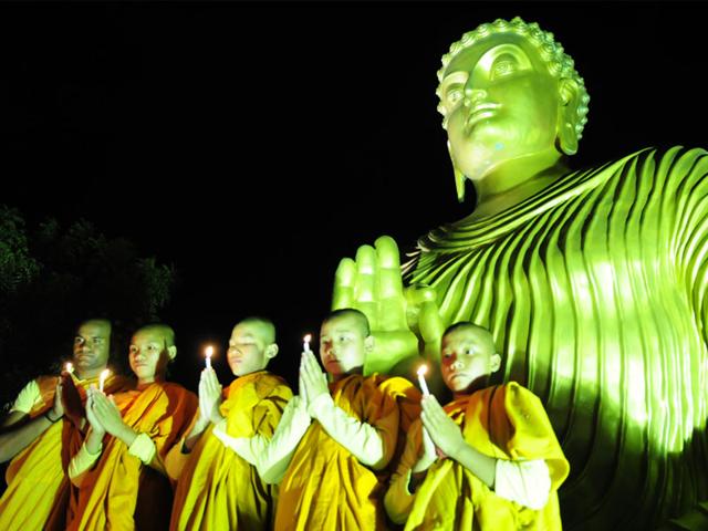 Buddha monks offer prayer on the eve of Buddha Purnima at a monastery, in Bhopal on Sunday. (Mujeeb Faruqui/HT photo)