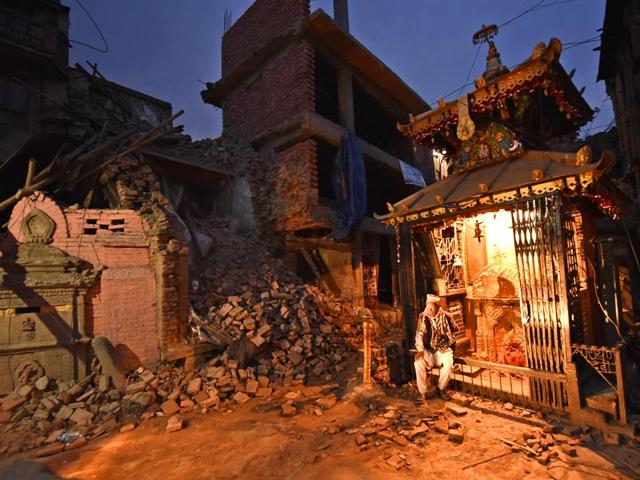An elderly Nepalese man sits on the entrance to a temple on the outskirts of Kathmandu. The devastation is Nepal has delivered a huge blow to the country's tourism industry. (Gurinder Osan/ HT Photo)