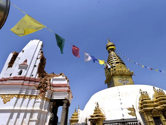 An earthquake-damaged temple stands next to the main stupa at Swayambhunath in Kathmandu. (Gurinder Osan/ HT Photo)