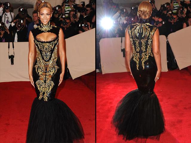 Beyonce, 2011; Queen B referenced 'Dolce Vita' style in this black and gold fishtail Emilio Pucci brocaded dress with lace décolletage detailing. Beyonce, 2011; Queen B referenced 'Dolce Vita' style in this black and gold fishtail Emilio Pucci brocaded dress with lace décolletage detailing.