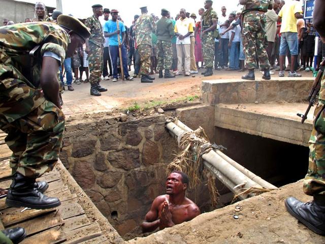 Niyonzima-kept-trying-to-escape-He-was-chased-through-a-courtyard-and-found-himself-cornered-between-two-buildings-Bleeding-from-his-head-he-begged-for-his-life-AFP-Photo Niyonzima-kept-trying-to-escape-He-was-chased-through-a-courtyard-and-found-himself-cornered-between-two-buildings-Bleeding-from-his-head-he-begged-for-his-life-AFP-Photo