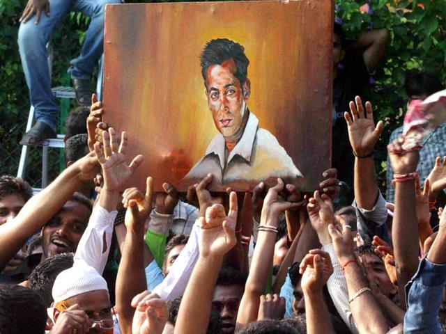 Salman Khan's fans celebrate outside his Galaxy Apartments residence after his return from the sessions court in Mumbai. (PTI photo)