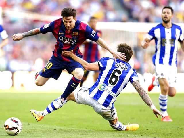 FC-Barcelona-s-Lionel-Messi-duels-for-the-ball-against-Real-Sociedad-s-Inigo-Martinez-during-a-Spanish-La-Liga-soccer-match-at-the-Camp-Nou-stadium-AP-Photo-Manu-Fernandez FC-Barcelona-s-Lionel-Messi-duels-for-the-ball-against-Real-Sociedad-s-Inigo-Martinez-during-a-Spanish-La-Liga-soccer-match-at-the-Camp-Nou-stadium-AP-Photo-Manu-Fernandez