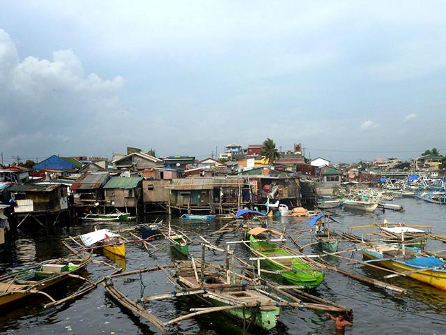 Fishing-outrigger-boats-are-anchored-at-the-mouth-of-a-river-feeding-Manila-Bay-as-the-Philippine-coast-guard-banned-sailing-due-to-nearby-Typhoon-Noul-in-the-northern-part-of-the-country-AFP-Photo Fishing-outrigger-boats-are-anchored-at-the-mouth-of-a-river-feeding-Manila-Bay-as-the-Philippine-coast-guard-banned-sailing-due-to-nearby-Typhoon-Noul-in-the-northern-part-of-the-country-AFP-Photo
