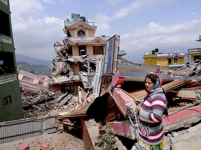 A-woman-stands-on-the-debris-of-collapsed-houses-in-Sankhu-Nepal-Reuters-Photo