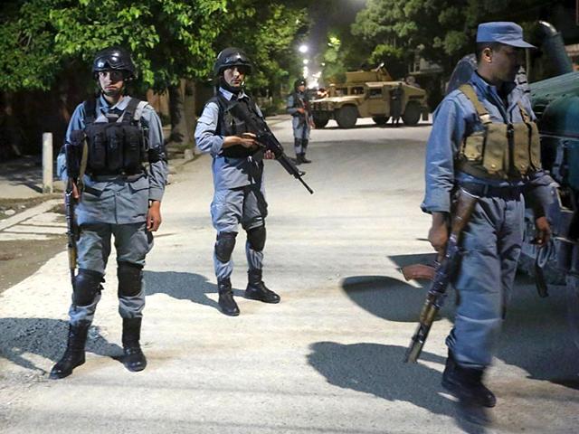 Afghan-security-forces-stand-guard-at-the-site-of-an-attack-in-Kabul-May-13-2015-Gunmen-stormed-a-building-in-an-upmarket-area-of-the-Afghan-capital-Kabul-on-Wednesday-night-and-shooting-was-continuing-an-army-commander-said-Reuters-Photo Afghan-security-forces-stand-guard-at-the-site-of-an-attack-in-Kabul-May-13-2015-Gunmen-stormed-a-building-in-an-upmarket-area-of-the-Afghan-capital-Kabul-on-Wednesday-night-and-shooting-was-continuing-an-army-commander-said-Reuters-Photo