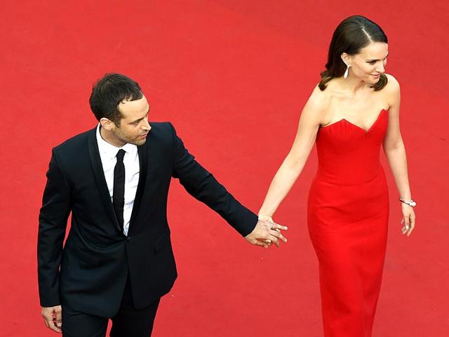 Natalie Portman and her husband French dancer and choreographer Benjamin Millepied pose as they arrive for the opening ceremony of the 68th Cannes Film Festival in Cannes. (AFP photo)
