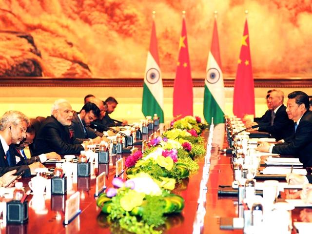 In-this-handout-photograph-taken-and-released-by-The-Indian-Press-Information-Bureau-PIB-Prime-Minister-Narendra-Modi-leads-his-delegation-in-talks-with-Chinese-President-Xi-Jinping-at-The-Shaanxi-Guest-House-in-Xi-an In-this-handout-photograph-taken-and-released-by-The-Indian-Press-Information-Bureau-PIB-Prime-Minister-Narendra-Modi-leads-his-delegation-in-talks-with-Chinese-President-Xi-Jinping-at-The-Shaanxi-Guest-House-in-Xi-an