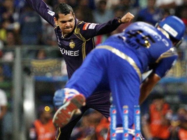 Kolkata Knight Riders' (KKR's) Sunil Narine celebrates the wicket of Mumbai Indians (MI) skipper Rohit Sharma during the IPL 2015 match between the two sides in Mumbai on May 14. (PTI Photo)