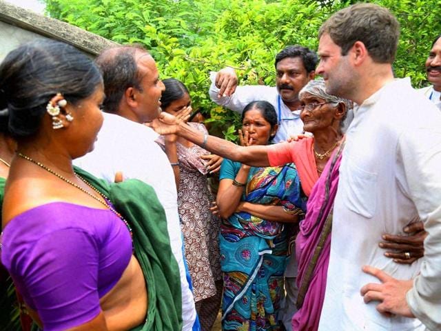 Congress-vice-president-Rahul-Gandhi-meets-family-members-of-the-famers-who-committed-suicide-during-his-15-KM-padyatra-on-farmers-issue-at-Nirmal-in-Adilabad-district-of-Telangana-PTI-Photo
