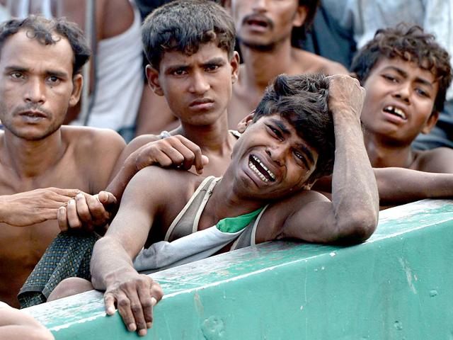 A-Rohingya-migrant-crying-as-he-sits-with-others-in-a-boat-drifting-in-Thai-waters-off-the-southern-island-of-Koh-Lipe-in-the-Andaman--Trafficking-experts-say-Thailand-is-the-centre-of-a-multi-million-dollar-trade-run-by-competing-transnational-criminal-syndicates-AFP-Photo