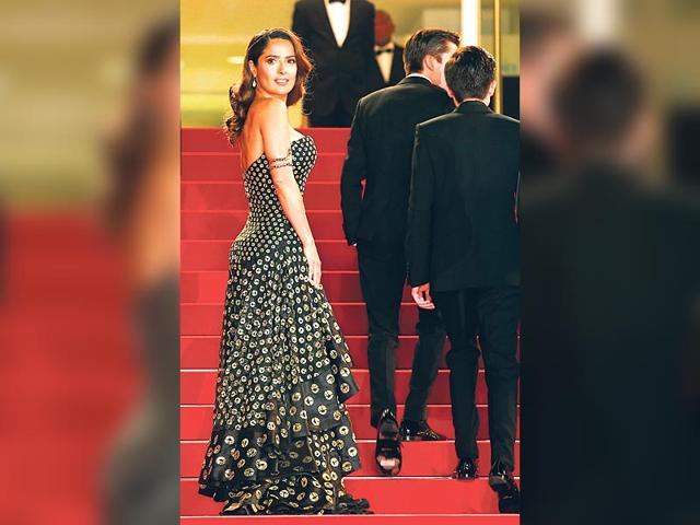 Salma Hayek: The actor looks like she was having fun in this strapless Alexander McQueen dress, with a fun print and a tiered, ruffled skirt. Thankfully, she kept the styling simple to prevent overcooking the look.