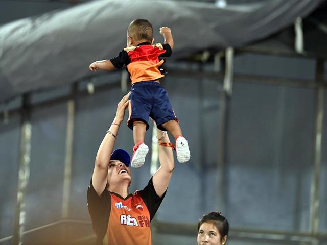 SRH opener Shikhar Dhawan's wife Ayesha plays with their son Zoravar at the stadium. (Santosh Harhare/HT Photo)