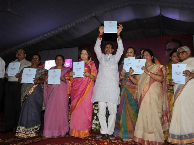 Chief Minister Shivraj Singh Chouhan releases the draft women's policy during Mahila Panchayat in Bhopal on Tuesday. (Praveen Bajpai/HT photo)