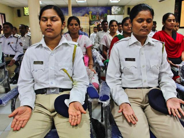 Thane traffic police participated in a mediation and relaxation programme at Teen Hath Naka office, in Thane. (Photo credit: Praful Gangurde)