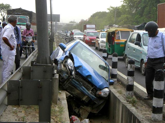 A-car-fall-down-in-drain-after-the-sudden-dust-storm-at-service-road-near-NH-8-between-Rao-Tula-Marg-and-Mahipalpur-in-New-Delhi-Sanjeev-Verma-HT-Photo A-car-fall-down-in-drain-after-the-sudden-dust-storm-at-service-road-near-NH-8-between-Rao-Tula-Marg-and-Mahipalpur-in-New-Delhi-Sanjeev-Verma-HT-Photo