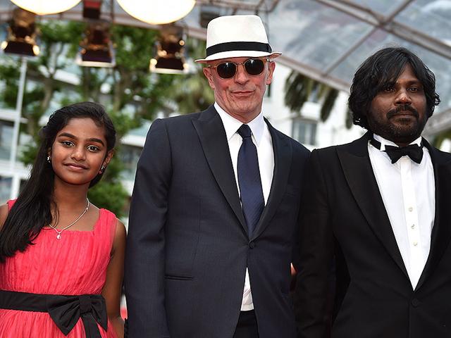 From-L-Sri-Lankan-actor-Claudine-Vinasithamby-French-director-Jacques-Audiard-and-Sri-Lankan-actor-Jesuthasan-Antonythasan-pose-as-they-arrive-for-the-screening-of-the-film-Dheepan-at-the-68th-Cannes-Film-Festival-in-Cannes-southeastern-France-on-May-21-2015-AFP From-L-Sri-Lankan-actor-Claudine-Vinasithamby-French-director-Jacques-Audiard-and-Sri-Lankan-actor-Jesuthasan-Antonythasan-pose-as-they-arrive-for-the-screening-of-the-film-Dheepan-at-the-68th-Cannes-Film-Festival-in-Cannes-southeastern-France-on-May-21-2015-AFP
