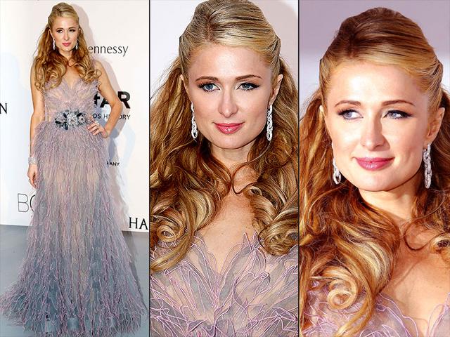 Heiress Paris Hilton poses at the amfAR Cinema Against AIDS benefit during the 68th Cannes international film festival on Thursday. (AP)