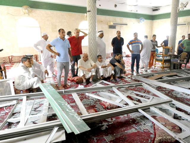 Men-gather-around-debris-following-a-blast-inside-a-mosque-in-Qatif-Saudi-Arabia-A-suicide-bomber-targeted-a-Shiite-mosque-during-Friday-prayers-in-Kudeih-the-interior-ministry-said-with-activists-saying-at-least-four-worshippers-were-killed-AFP-Photo Men-gather-around-debris-following-a-blast-inside-a-mosque-in-Qatif-Saudi-Arabia-A-suicide-bomber-targeted-a-Shiite-mosque-during-Friday-prayers-in-Kudeih-the-interior-ministry-said-with-activists-saying-at-least-four-worshippers-were-killed-AFP-Photo