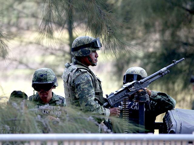 Mexican-Army-soldiers-stand-guard-near-the-entrance-of-Rancho-del-Sol-AP-Photo Mexican-Army-soldiers-stand-guard-near-the-entrance-of-Rancho-del-Sol-AP-Photo