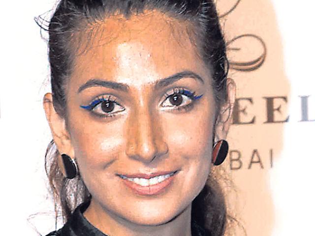 Singer Monica Dogra aces clumpy lashes with a swipe of azure. Get the look by applying mascara in upward and backward strokes. Mark the eyeliner from the center of the lid, flicking it upwards.