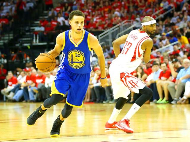 Stephen-Curry-of-the-Golden-State-Warriors-drives-against-Corey-Brewer-of-the-Houston-Rockets-in-the-third-quarter-during-Game-Three-of-the-Western-Conference-Finals-of-the-2015-NBA-PLayoffs-at-Toyota-Center-in-Houston-Texas-AFP-Photo Stephen-Curry-of-the-Golden-State-Warriors-drives-against-Corey-Brewer-of-the-Houston-Rockets-in-the-third-quarter-during-Game-Three-of-the-Western-Conference-Finals-of-the-2015-NBA-PLayoffs-at-Toyota-Center-in-Houston-Texas-AFP-Photo