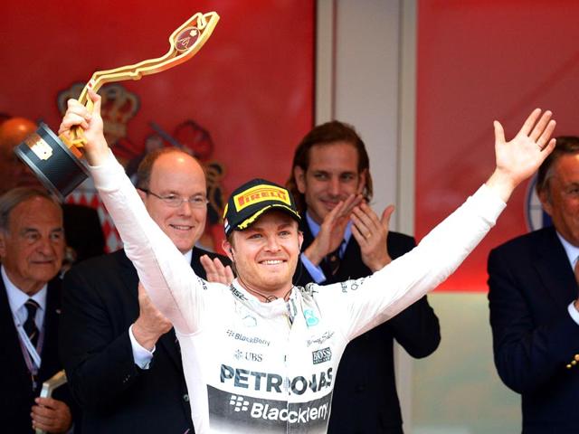 Mercedes-AMG-Petronas-F1-Team-s-German-driver-Nico-Rosberg-celebrates-with-his-trophy-on-the-podium-after-winning-the-Monaco-Formula-One-Grand-Prix-at-the-Monaco-street-circuit-in-Monte-Carlo-AFP-PHOTO Mercedes-AMG-Petronas-F1-Team-s-German-driver-Nico-Rosberg-celebrates-with-his-trophy-on-the-podium-after-winning-the-Monaco-Formula-One-Grand-Prix-at-the-Monaco-street-circuit-in-Monte-Carlo-AFP-PHOTO