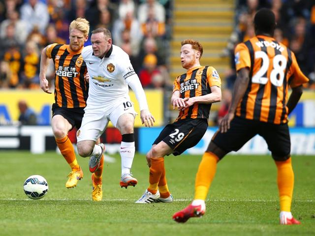 Hull-City-s-Paul-McShane-and-Stephen-Quinn-in-action-against-Manchester-United-s-Wayne-Rooney-in-their-English-Premier-League-EPL-match-at-Kingston-Communications-Stadium-on-May-24-2015-Reuters-Photo Hull-City-s-Paul-McShane-and-Stephen-Quinn-in-action-against-Manchester-United-s-Wayne-Rooney-in-their-English-Premier-League-EPL-match-at-Kingston-Communications-Stadium-on-May-24-2015-Reuters-Photo