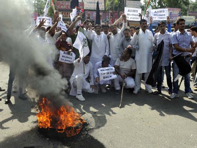 Panthers party workers raising slogans and burning tyres during a protest in Jammu. Nitin Kanotra/HT